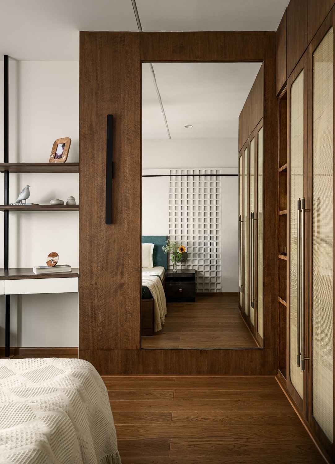 Walnut-framed full-length mirror and master bedroom passage